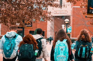 A Group of People Wearing Backpacks