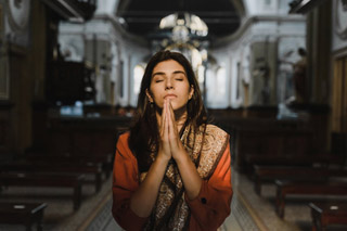 Woman Praying in Church