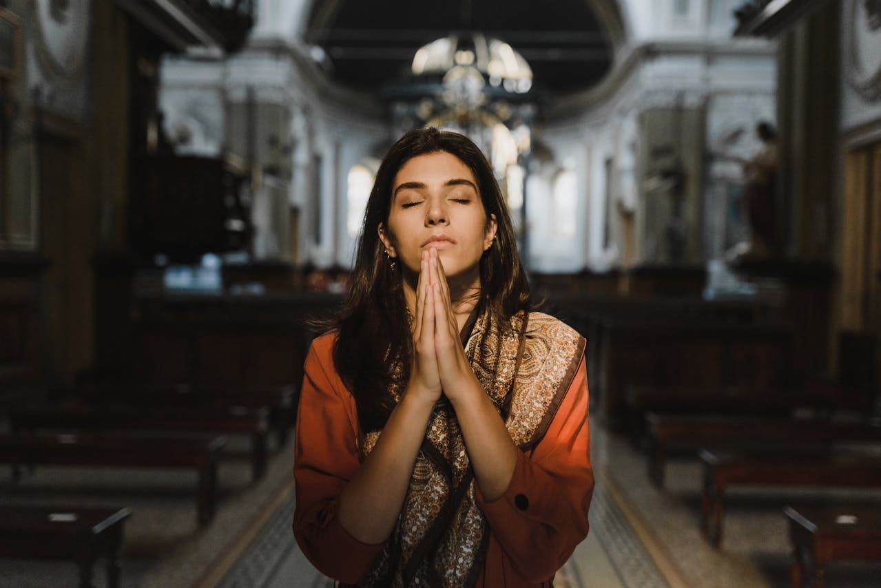 Woman Praying in Church